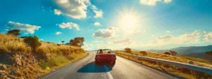 a vibrant family road trip scene unfolds under a brilliant blue sky, as a sleek car gleams in the sunlight while joyful smiles reflect the spirit of adventure and togetherness.