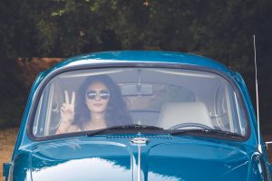 girl in blue vw bug